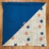 Floral Harmony Dual-Tone Cushion Cover in blue and white, front view featuring elegant floral embroidery and checkered detail