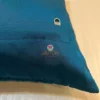 Back view of Azure Comfort Chevron Cushion in blue with secure zipper closure detail
