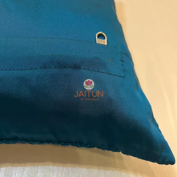 Back view of Azure Comfort Chevron Cushion in blue with secure zipper closure detail