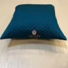 Single Azure Comfort Chevron Cushion in blue, showcasing stylish zigzag design on bed surface