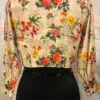 Rear view of Blossom Elegance Floral Blouse with vivid flower print and graceful shaping
