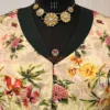 Closeup of neckline and vibrant floral print on Blossom Elegance Floral Blouse
