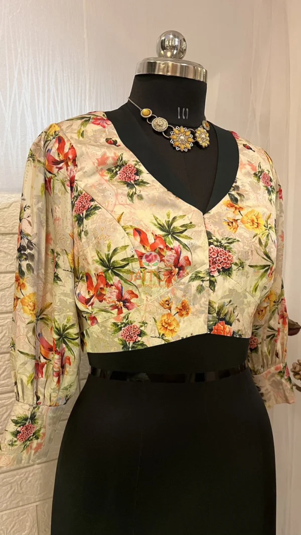 Side angled view of Blossom Elegance Floral Blouse showcasing detailed flower pattern and stylish sleeves