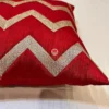 Close-up Detail of Red and Golden Chevron Pattern Cushion, Premium Textured Fabric Highlight