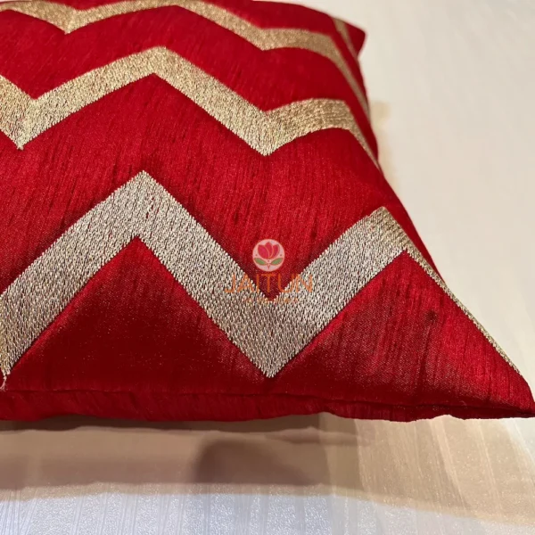 Close-up Detail of Red and Golden Chevron Pattern Cushion, Premium Textured Fabric Highlight