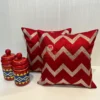 Pair of Chevron Pattern Red & Golden Cushions Styled with Decorative Jars for Home Décor