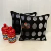 Eclipse Polka Dot Cushion Pair styled with traditional decor jars, black and silver cushion set for home styling