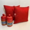 Pair of Elegant Chevron Red Cushion Covers styled with red and yellow decorative jars for home décor
