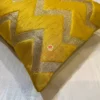 Fabric closeup of Yellow Chevron Luxe Throw Cushion, showing rich color and shimmer