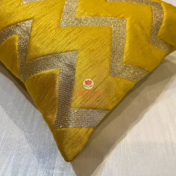 Fabric closeup of Yellow Chevron Luxe Throw Cushion, showing rich color and shimmer