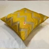 Yellow Chevron Luxe Cushion shown in side angle, highlighting the shine and texture of the chevron pattern