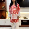 Front view of Coral Floral Co-Ord Set with bold white lace detailing and vibrant coral floral print