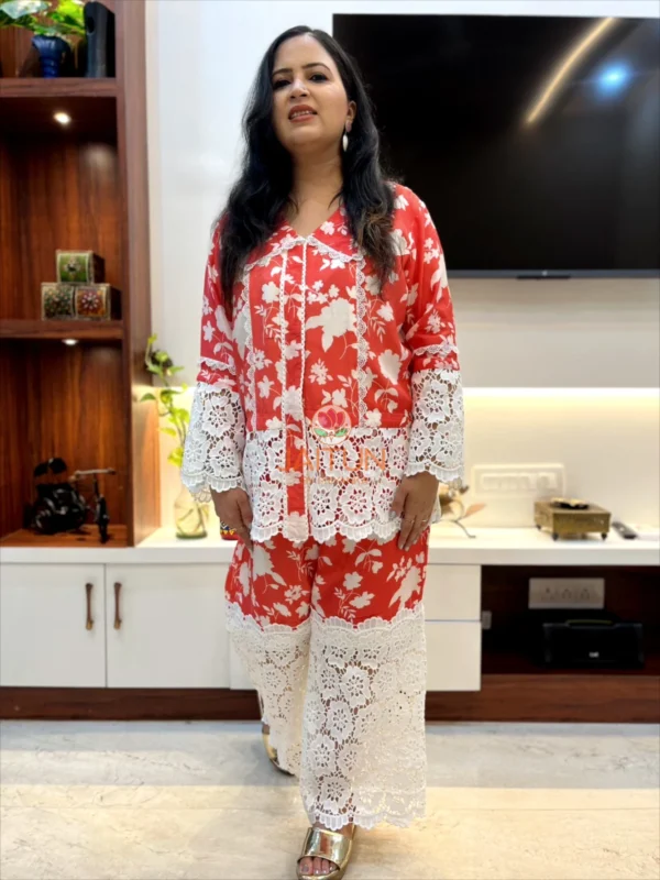 Front view of Coral Floral Co-Ord Set with bold white lace detailing and vibrant coral floral print