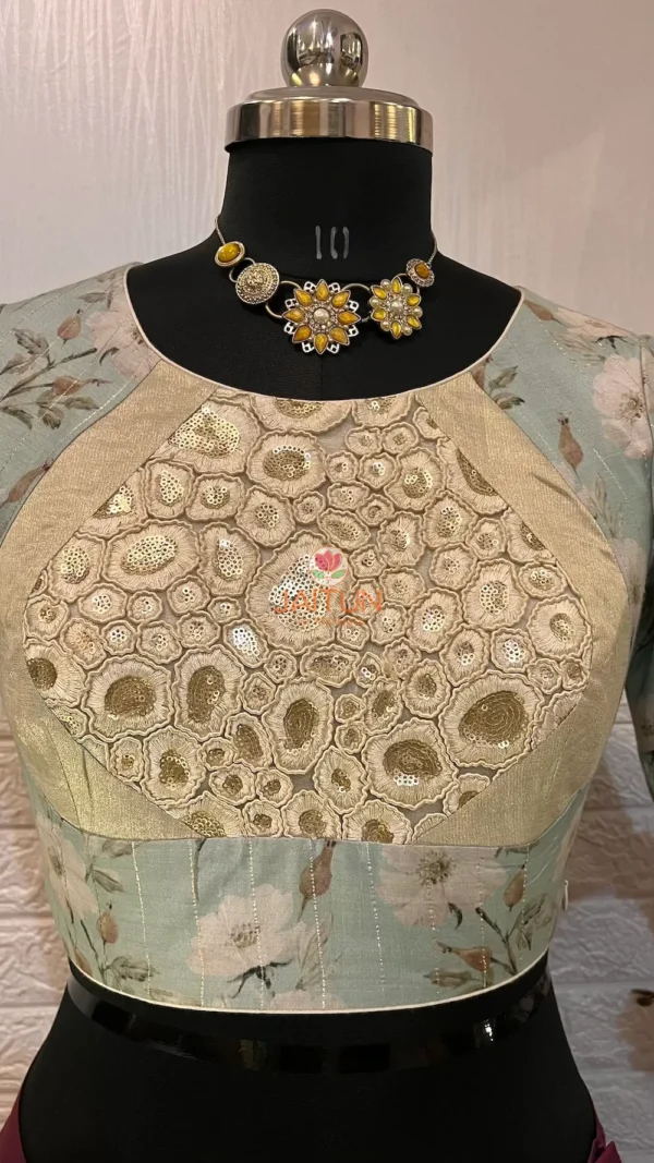 Closeup of Elegant Blossom Embroidered Crop Top Blouse with golden threadwork and pastel blue floral fabric