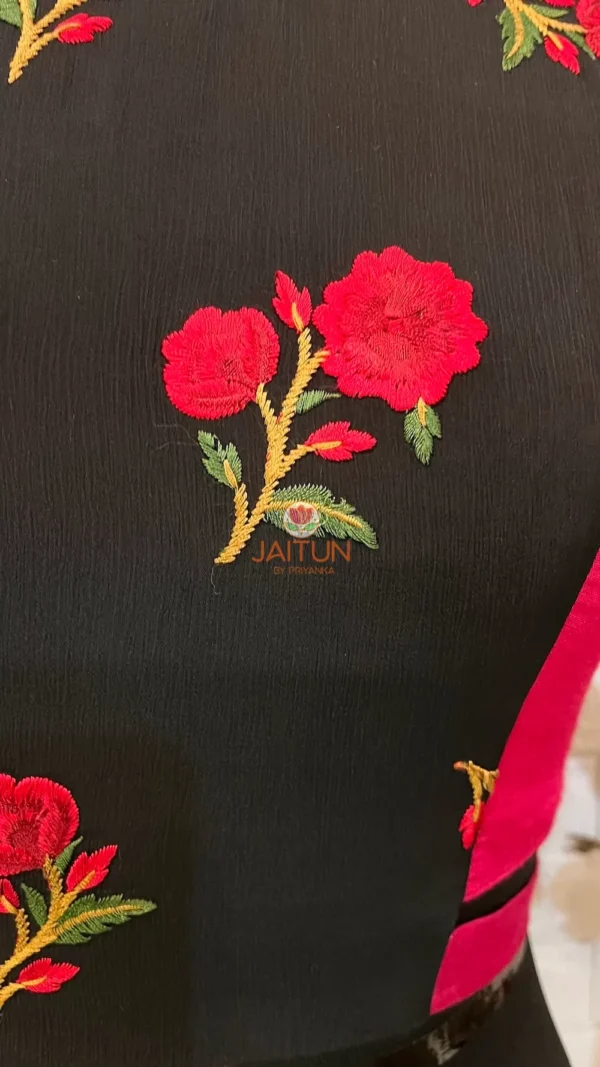 Intricate pink and red floral embroidery on black fabric of Floral Fantasy Ruffle Sleeve Crop Blouse