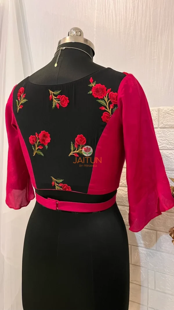 Back view of Floral Fantasy Ruffle Sleeve Crop Blouse featuring all-over red floral embroidery and fitted waist