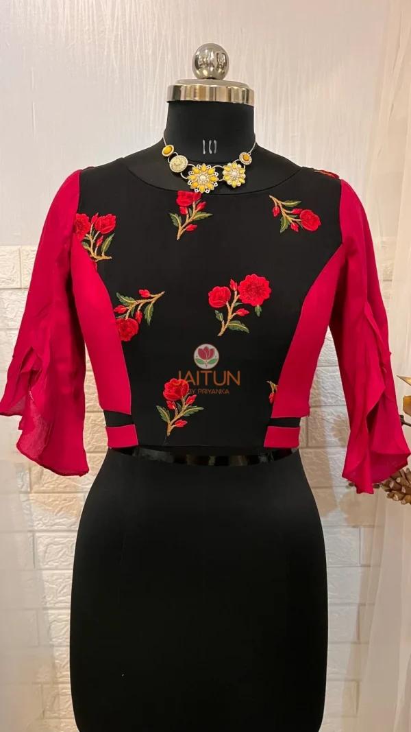 Floral Fantasy Ruffle Sleeve Crop Blouse with black base, vibrant red floral embroidery, and statement ruffle sleeves