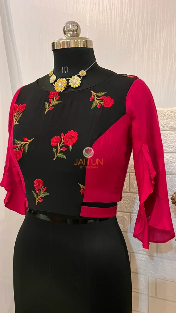 Side angle of Floral Fantasy Ruffle Sleeve Crop Blouse showing floral embroidery and ruffle sleeve details