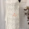 Close-up of the elegant long drape sleeve on Geometric Elegance Straight Dress, featuring sleek white Chinnon crepe and geometric silver embroidery.