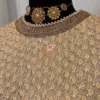 Back view of Golden Grace A-Line Kurta in golden tones, showing elegant fit, gold trim, and festive embellishments for special occasions and party wear.