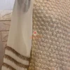 Close-up detail of Golden Grace Embellished A-Line Kurta featuring fine geometric patterns and shimmering gold embellishments, ideal for Kurti & Dresses collections and festive wear.