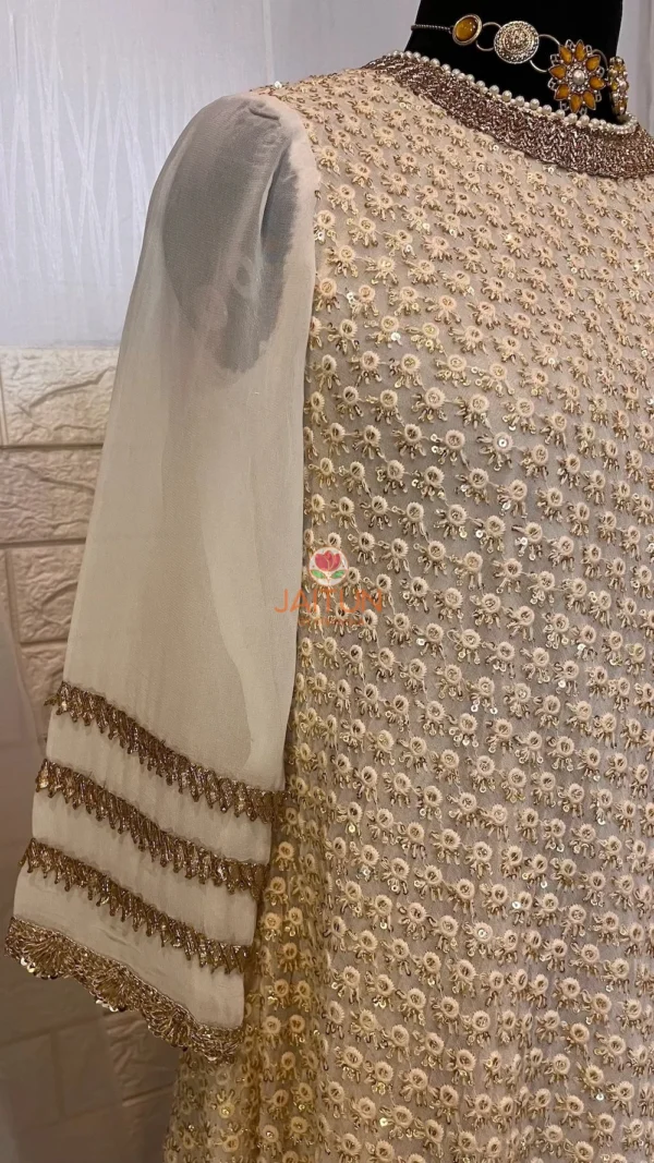 Close-up detail of Golden Grace Embellished A-Line Kurta featuring fine geometric patterns and shimmering gold embellishments, ideal for Kurti & Dresses collections and festive wear.