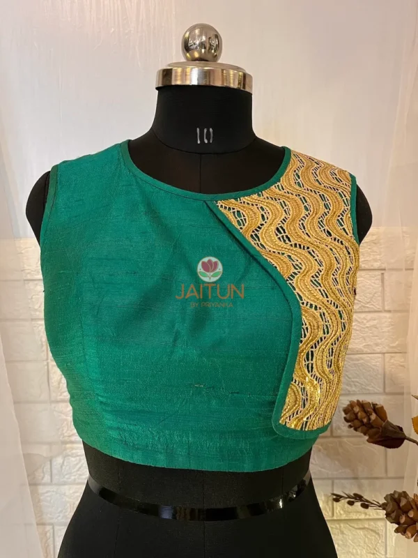 Teal Green Silk Blouse with Golden Embroidered Panel front view, sleeveless and elegant silk texture