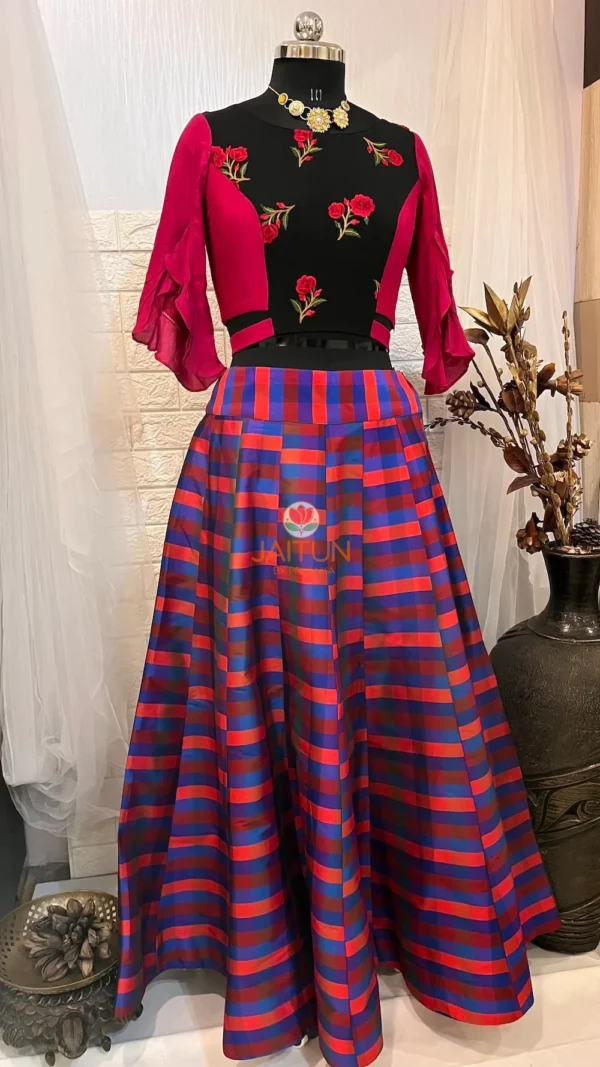 Vibrant Vogue Striped Maxi Skirt Lehenga displayed at an angle showing striped skirt and floral embroidered blouse