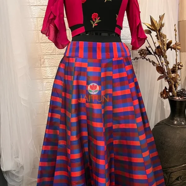 Vibrant Vogue Striped Maxi Skirt Lehenga displayed at an angle showing striped skirt and floral embroidered blouse