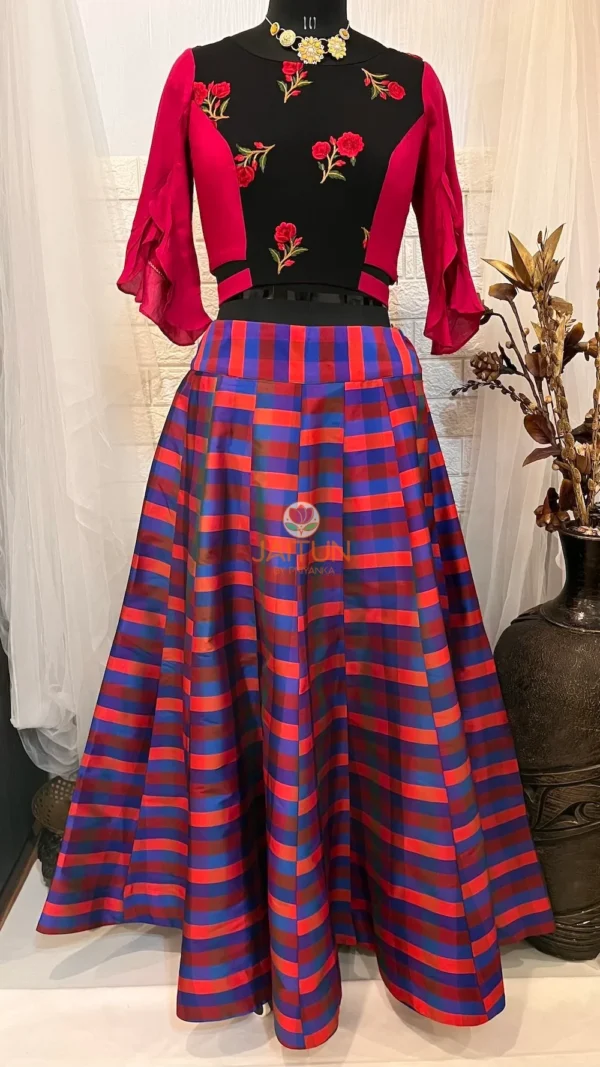 Front view of Vibrant Vogue Striped Maxi Skirt Lehenga featuring bold multicolour stripes and embroidered blouse