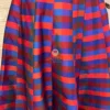 Waistband and pleat details on striped Vibrant Vogue Lehenga Maxi Skirt