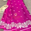 Magenta Grace Banarasi Silk Saree flatlay featuring intricate silver floral border, delicate silk texture, and white bangles