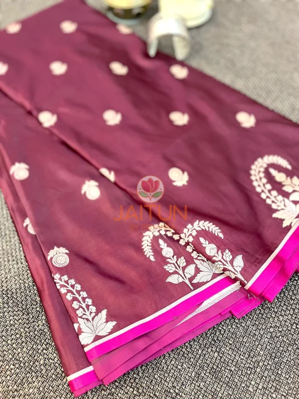 Closeup of border on Mulberry Grace Silk Saree showing elaborate white floral embroidery and classic Banarasi craftsmanship