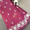 Detailed view of Mulberry Grace Silk Saree featuring rich mulberry color, intricate white embroidery, and elegant edge detailing