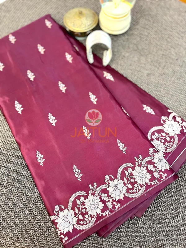 Detailed view of Mulberry Grace Silk Saree featuring rich mulberry color, intricate white embroidery, and elegant edge detailing