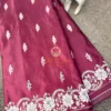Mulberry Grace Silk Saree flatlay with white floral embroidery and ornate border, styled with silver bangles and brass decor