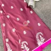 Mulberry Grace Silk Saree styled with stacked silver bangles and decor, highlighting floral embroidered border and rich silk finish