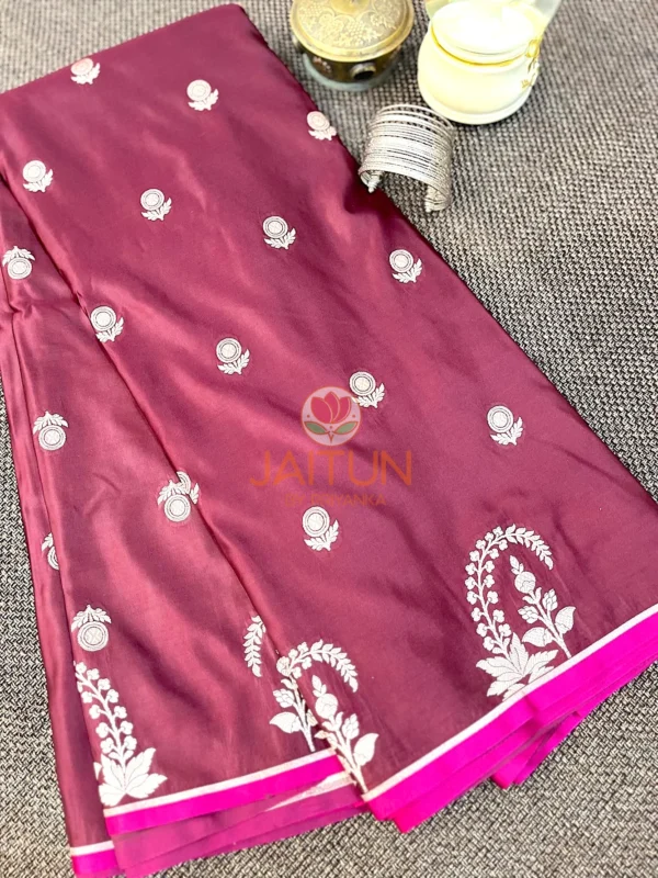 Mulberry Grace Silk Saree styled with stacked silver bangles and decor, highlighting floral embroidered border and rich silk finish