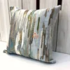 Silver Sage Abstract Embroidered Velvet Cushion Cover – Angled View Angled view of Silver Sage Abstract Embroidered Velvet Cushion Cover with abstract brushstroke pattern and elegant detailing