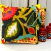 Pair of Boho Garden appliqué cushion covers featuring colourful leaves and flowers