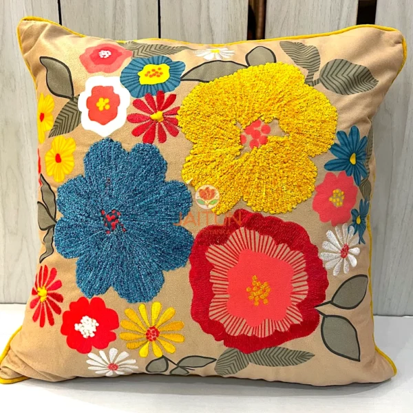 Floral Fiesta Cushion Cover Close-Up - Intricate Blue, Yellow, and Red Embroidery Detail