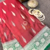 Detail view of Gulnaar Maroon Silk Saree showing classic Banarasi gold motifs and intricate floral zari border