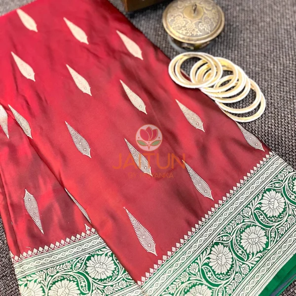Detail view of Gulnaar Maroon Silk Saree showing classic Banarasi gold motifs and intricate floral zari border