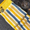 Mustard & Blue Striped Chiniya Silk Saree flatlay featuring vibrant vertical stripes and intricate floral zari border