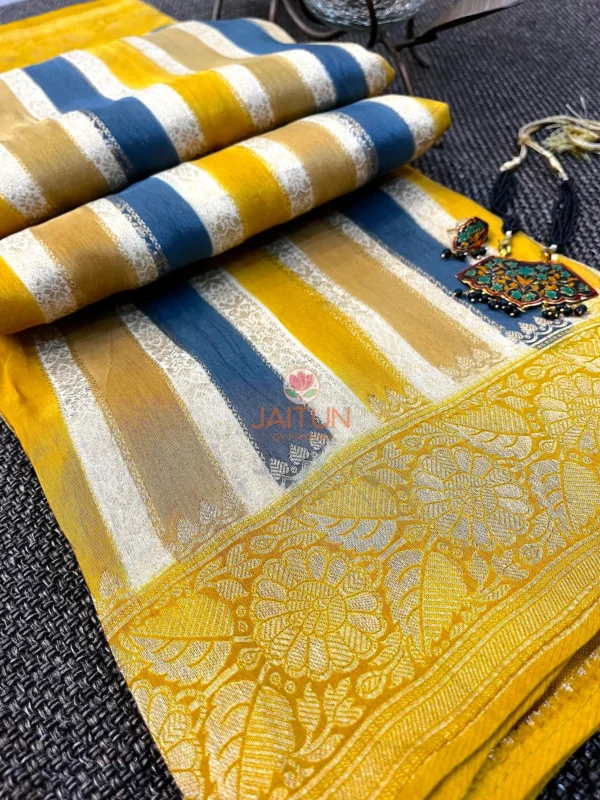 Closeup of pallu on Mustard & Blue Striped Chiniya Silk Saree, showcasing ornate gold floral weaving with blue and mustard stripes