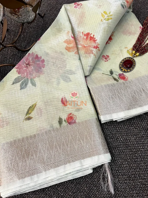 Pastel Bloom Banarasi Printed Kota Silk Saree flatlay featuring soft floral motifs, detailed silver zari border, and elegant pastel tones