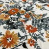 Closeup of Amber Floral Bloom bed sheet floral print in orange, yellow, and grey on white background