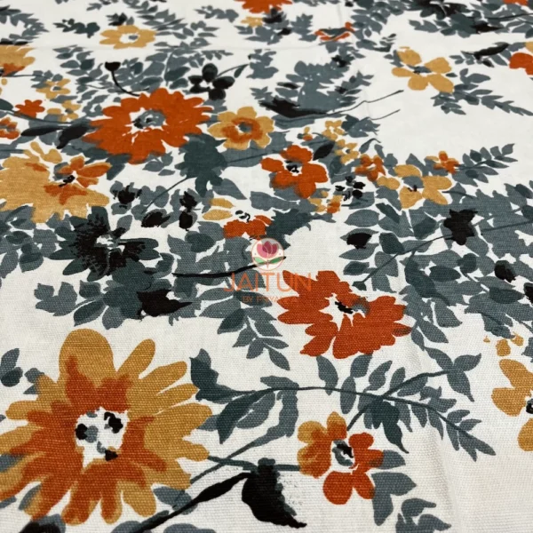 Closeup of Amber Floral Bloom bed sheet floral print in orange, yellow, and grey on white background