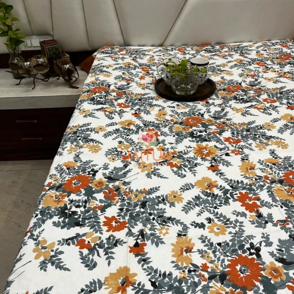 Amber Floral Bloom bed sheet set spread on bed, highlighting all-over floral design in warm tones