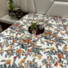 Room view of Amber Floral Bloom bed sheet set styled with tableware and leafy floral design in bedroom